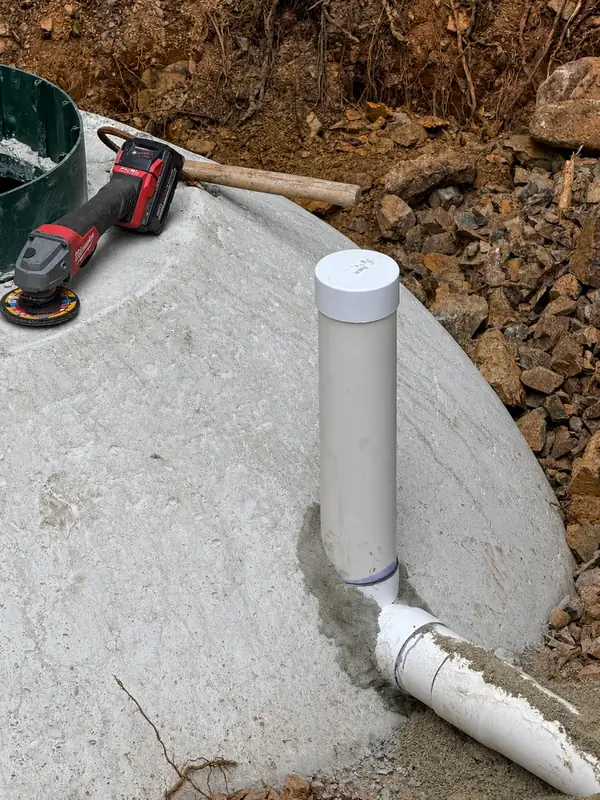 Capped pipe connection on a septic tank during a TTIS septic installation in Port Alberni